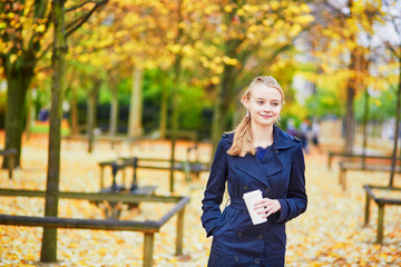 Young woman in the Luxembourg garden of Paris on a fall day