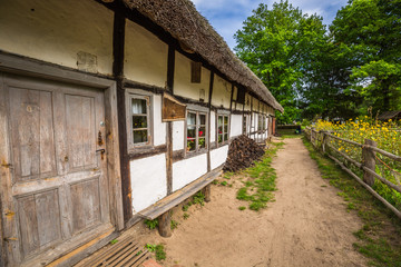 Fototapeta na wymiar Old fisherman's houses in Kluki village, Poland.