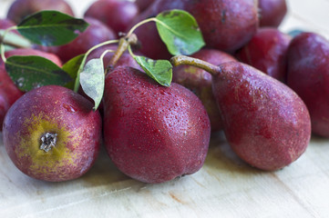Ripe red pear on a wooden table