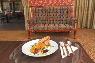 Potato pancakes with vegetable salad and homemade bread.