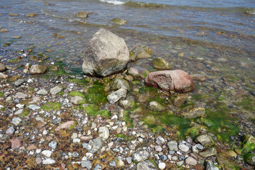 Stones in the water at the beach on Hiddensee Island, Germany