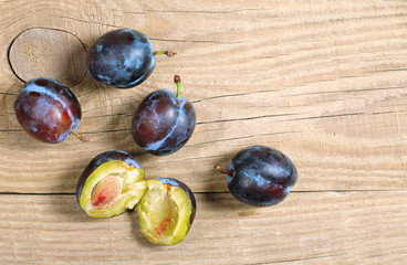 Plums on table
