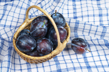 Plums in basket