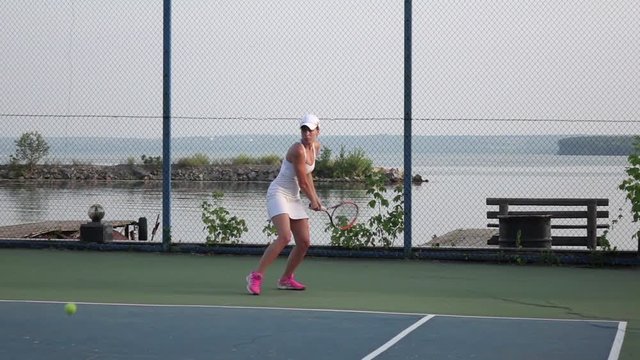 Female tennis player practicing tennis. Slow motion