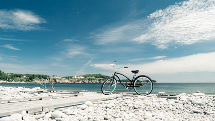 Fototapeta premium Beach bike on stony beach at Gulf of St. Lawrence