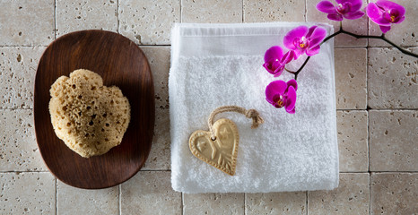 Fototapeta na wymiar body care concept with natural sponge, valentines soap and cotton towel
