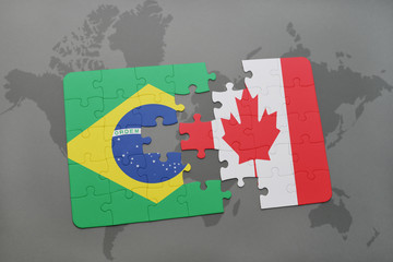 puzzle with the national flag of brazil and canada on a world map background.
