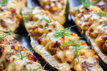 Grilled courgettes stuffed with meat and vegetables
