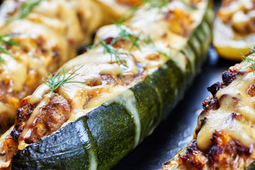 Grilled courgettes stuffed with meat and vegetables