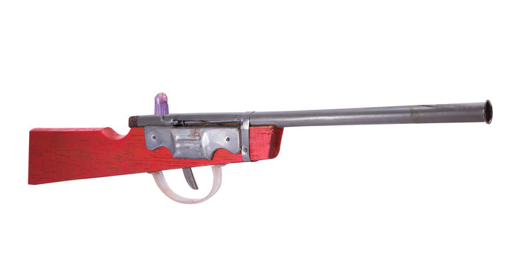 Wooden toy gun on white background
