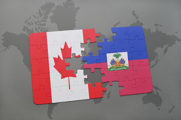 puzzle with the national flag of canada and haiti on a world map background.