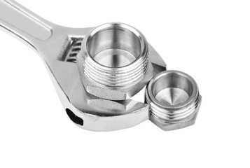 Plumbing fitting and wrench