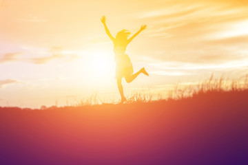 Fototapeta premium Silhouette of a beautiful girl jumping