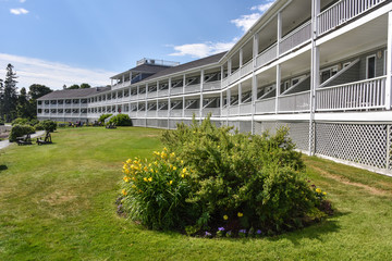 External hotel building with large grass area