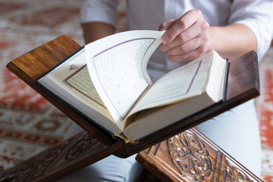 Koran in hand - holy book of Muslims ( public item of all muslim