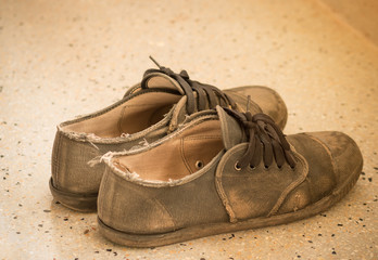 Naklejka premium Old Thai student shoes, poor student in school