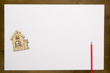 Model home on a white sheet of paper