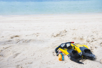 Fins, diving masks and camera for underwater on the beach