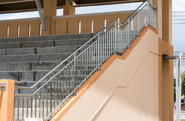 Stainless steel handrails and steps in a building stadium.