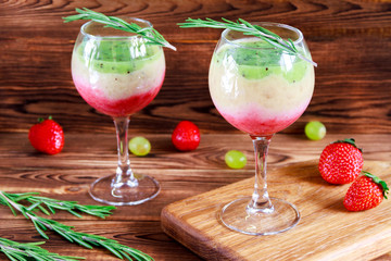 Healthy Layered smoothie made from strawberry, kiwi, bananas. Selective focus