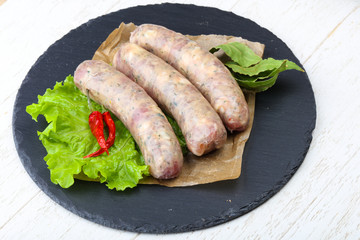 Raw sausages for cooking