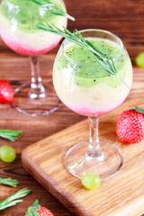 Healthy Layered smoothie made from strawberry, kiwi, bananas. Selective focus