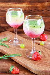 Healthy Layered smoothie made from strawberry, kiwi, bananas. Selective focus