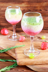 Healthy Layered smoothie made from strawberry, kiwi, bananas. Selective focus