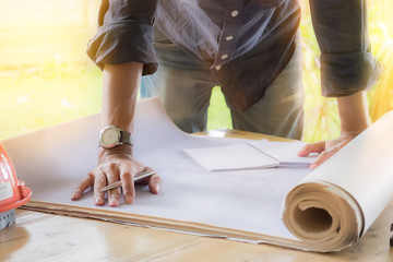 Young man working on his plane project at site construction work