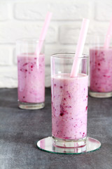 Healthy smoothie made from European black currant in a tall glas