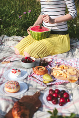 girl with watermelon on picnic