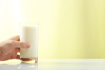 hand hold glass with milk