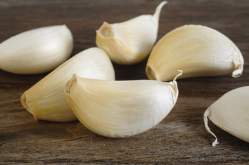 garlic cloves on wooden background
