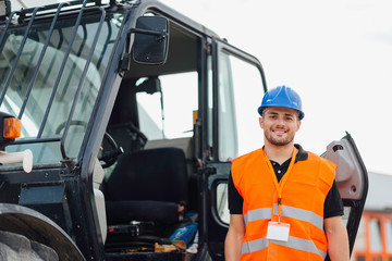 Skid steer loader operator at the construction site