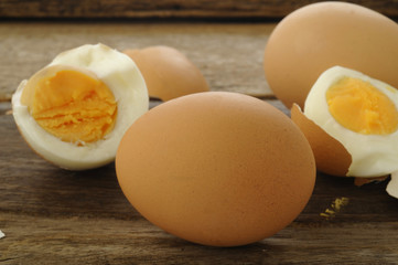 Egg boiled on old wooden background