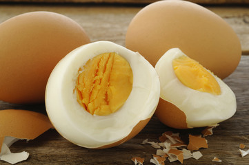 Egg boiled on old wooden background