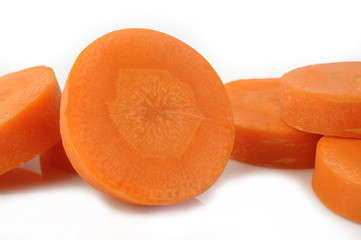 Fresh sliced carrots on white background