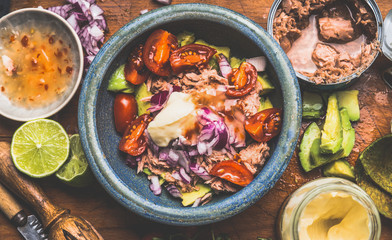 Canned  tuna fish salad or filling , preparation with ingredients, top view