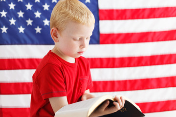 American patriotic boy reading Holy Bible