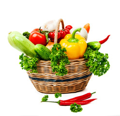 Fresh vegetables in basket isolated on white