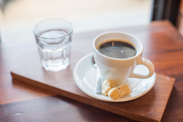 hot coffee with small biscuits