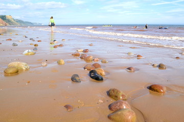 Beach during low tide in Sidmouth, Devon is part of Jurassic Coast which was awarded World Heritage...