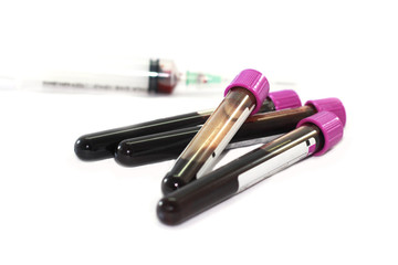 Obraz na płótnie Canvas Blood and urine specimen test and syringe on white background