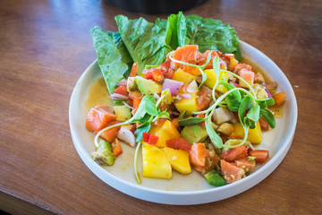 Vegetable salad with salmon.