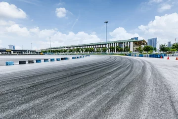 Zelfklevend Fotobehang Asphalt road Vehicle track in outdoor circuit © ABCDstock