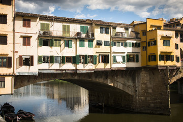 The medieval Ponte Vecchio bridge over the Arno river is one of the most famous tourist attractions in Florence, Italy
