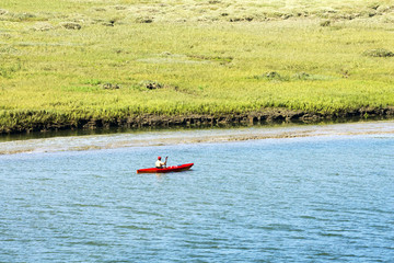 Fototapeta na wymiar mature man kayaking in the river 