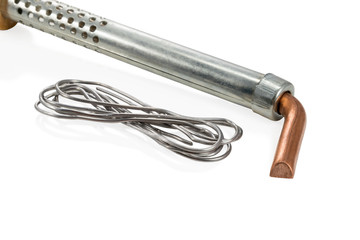 Copper soldering iron and tin wire close up isolated on white background