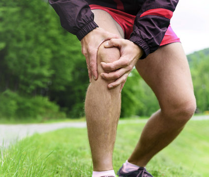 Man Out Jogging With Knee Pain