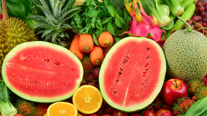 Watermelon slice with group fruits and fresh vegetables